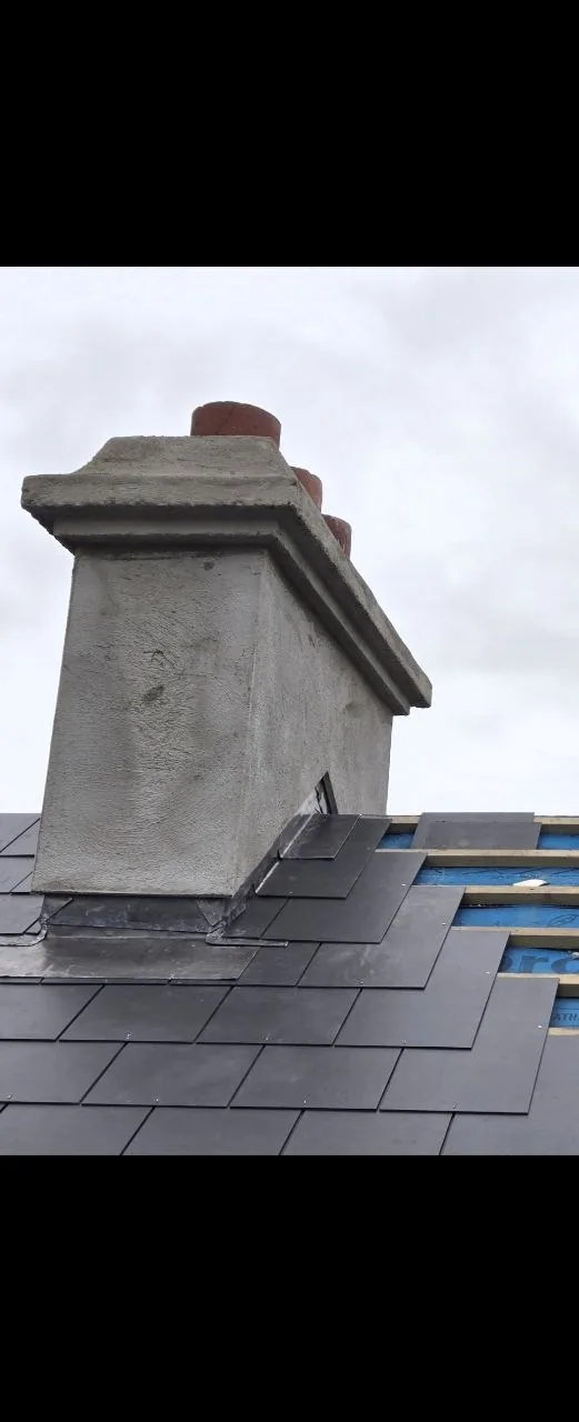 Rendered chimney with new lead flashing and slate
