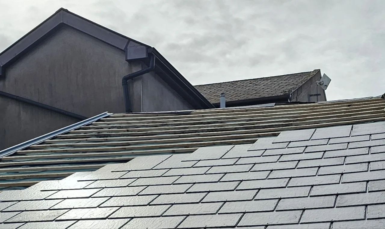 New battens and slate going on a house roof