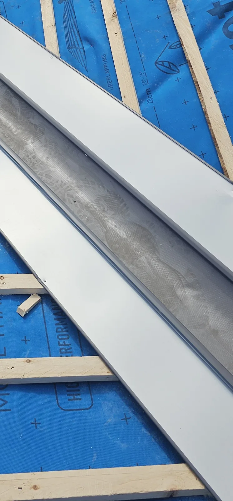 Dry valley trough laid over battens and membrane during a roof replacement