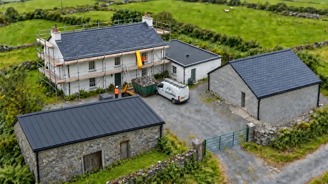 New slate roof on a garage and new anthracite metal roof on a stone barn